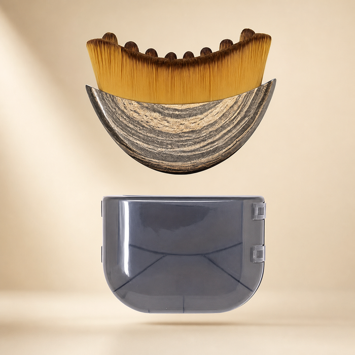 Exact crescent facial brush and smoky travel case on an ivory studio background
